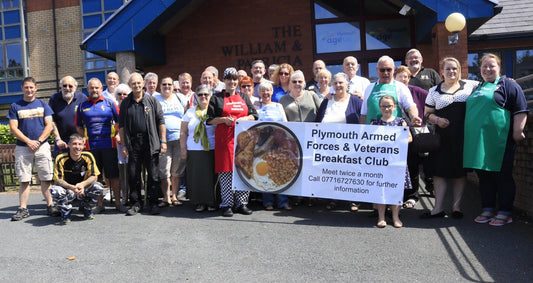 Veterans and supporters at the Plymouth Armed Forces & Veterans Breakfast Club gathering in Plymouth, promoting unity, healthcare access, and community support.